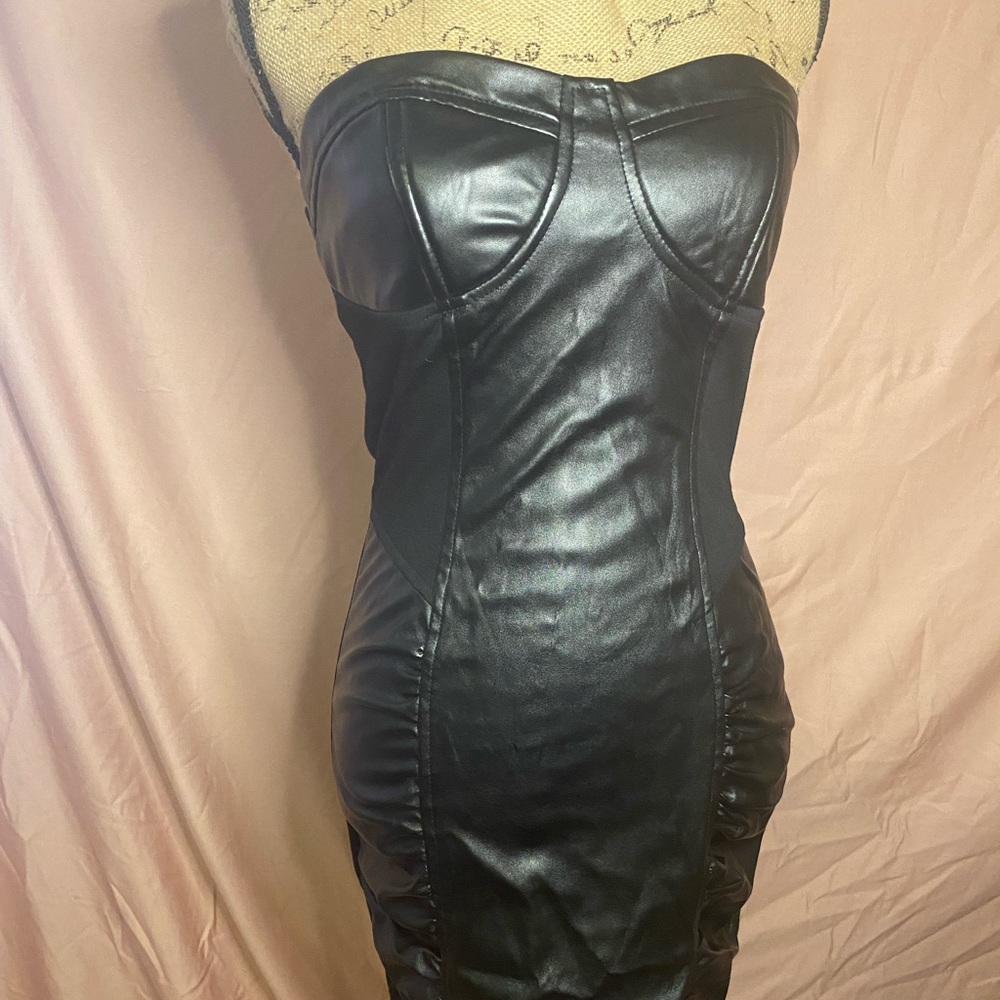 Women’s black cocktail dress.